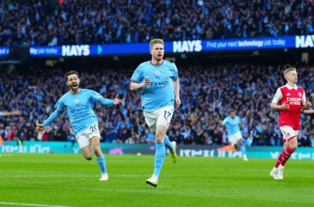 CITY TRASH ARSENAL 4-1 TO CLOSE GAP ON LEADERS TO TWO POINTS
